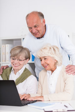 Teamwork - senior people working together