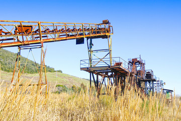 Fototapeta na wymiar Old conveyor belt of an abandoned industry