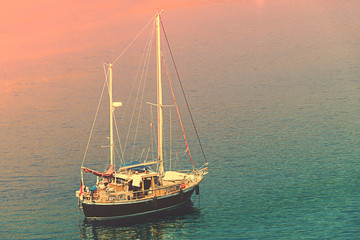 Boat with flagpole  on the water surface