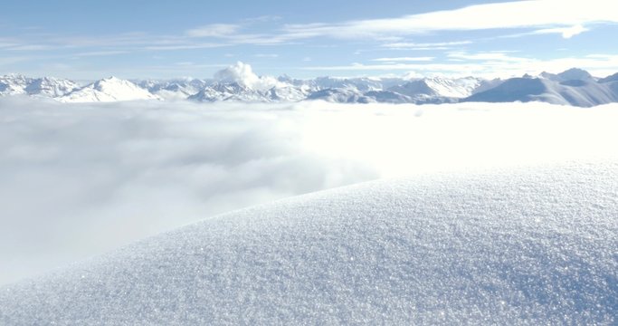 Intact snow in the foreground and mountains view in the background.. RAW FOOTAGE