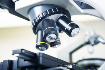 Scientific microscope lens close-up.