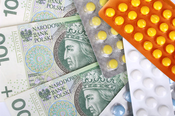 Zloty money bills and colorful pills
