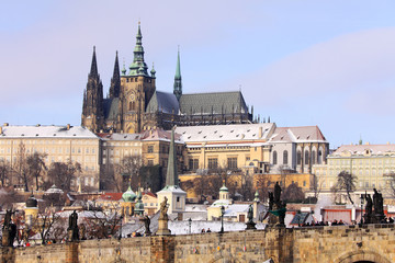 Christmas snowy Prague gothic Castle above River Vltava in the sunny Day, Czech Republic