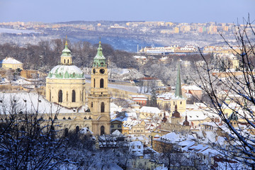 Obraz premium Christmas snowy Prague Lesser Town with St. Nicholas' Cathedral, Czech Republic