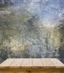 Wood table top with grunge cement background