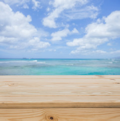 Fototapeta na wymiar Wood table top with sea background