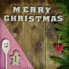 text Merry Christmas on old wooden background