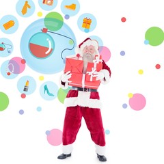 Composite image of santa carrying gifts