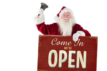 Composite image of santa holds a sign and rings his bell