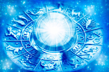 zodiac with astrological symbols and crystal ball with light