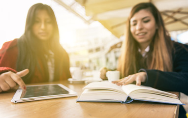 Obraz premium Two friends reading books, normal and Digital way