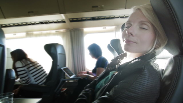 Business Woman Eating in First Class of a Train