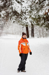 Woman in winter forest