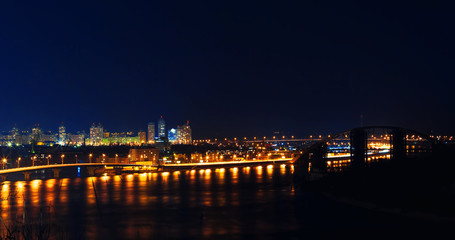 Fototapeta na wymiar Kiev city in Ukraine at night with reflection in water