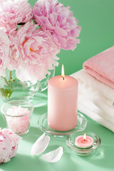 bath and spa with peony flowers candles towels