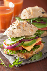 tomato avocado cheese sandwich with cucumber onion