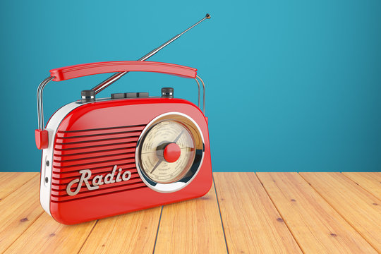 Vintage red radio receiver on wood table. Wallpaper 3d