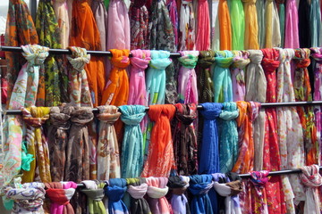 Multicoloured scarves on a market stall