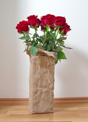 bouquet of red roses in vintage vase