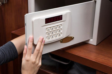woman hand opened a safe, close up , open