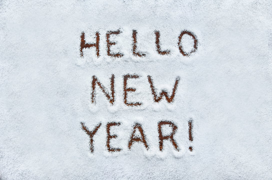 Text HELLO NEW YEAR written on snow. Horizontal postcard with sp