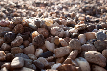 Abstract background with small smooth river pebbles