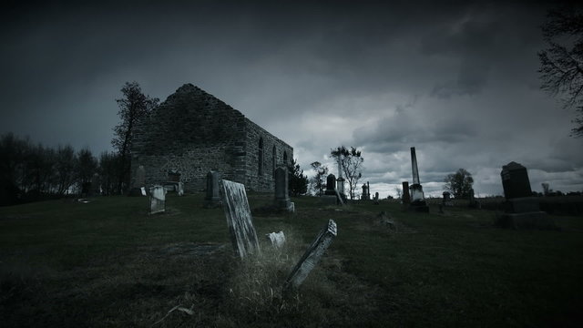 Toned Time Lapse of a Very Dark and Sullen Halloween kind of Footage of Abandoned Church and Cemetery on a Moody Cloudy Day