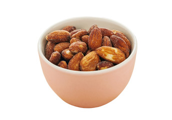 Almonds in a pink bowl isolated, Clipping path