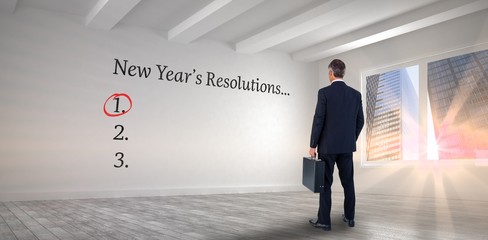 Businessman looking at new year's resolution list