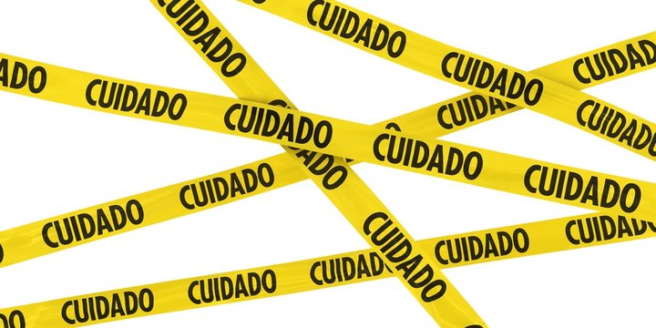 Yellow CUIDADO Barrier Tape Background Isolated on White