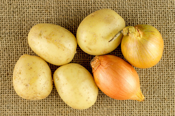 Potatoes and onions on burlap