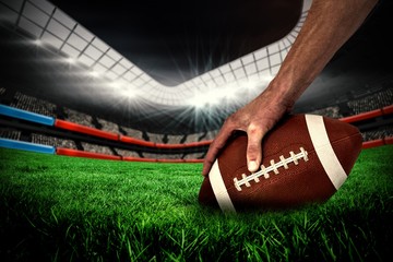 Composite image of american football player playing - Powered by Adobe