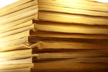 Stack of old magazines as background