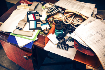 Messy workplace with paper on table