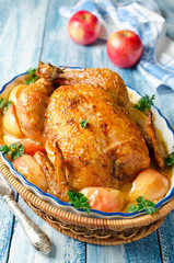 Whole roasted chicken with apples and cream sauce