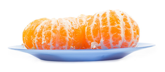The tangerines peeled in a blue plate