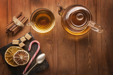 Obraz na płótnie Canvas tea sweet sugar on wooden table (top view)