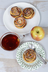 small apple cakes with a cup of tea and apple