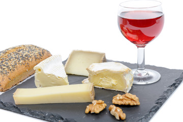  French cheeses on slate with bread and nuts