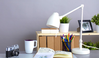 Designer table with him lying on the instruments and camera