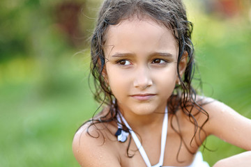 portrait of little girl outdoors in summer © zagorodnaya