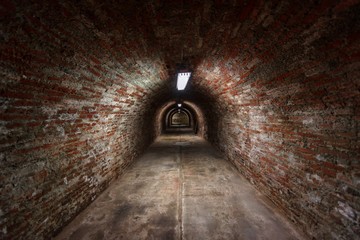 Long underground brick tunnel angle shot