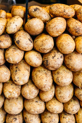 Potatoes forming background on farmers market