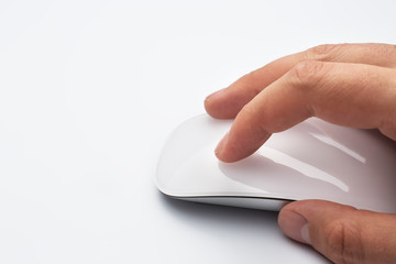 Hand holding a wireless computer mouse.