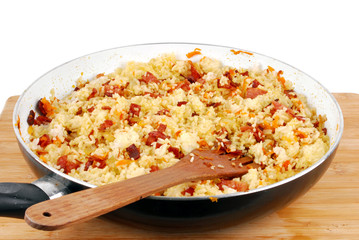 pan of rice with ham carrots and onion