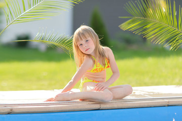 portrait of little girl outdoors in summer