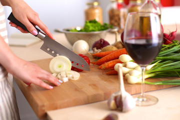 Young Woman Cooking in the kitchen. Healthy Food