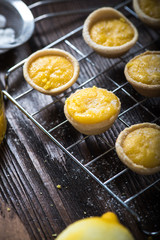 Lemon and custard tarts on cooling tray