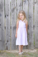 Naklejka premium portrait of little girl outdoors in summer