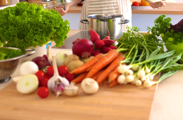 Young Woman Cooking in the kitchen. Healthy Food